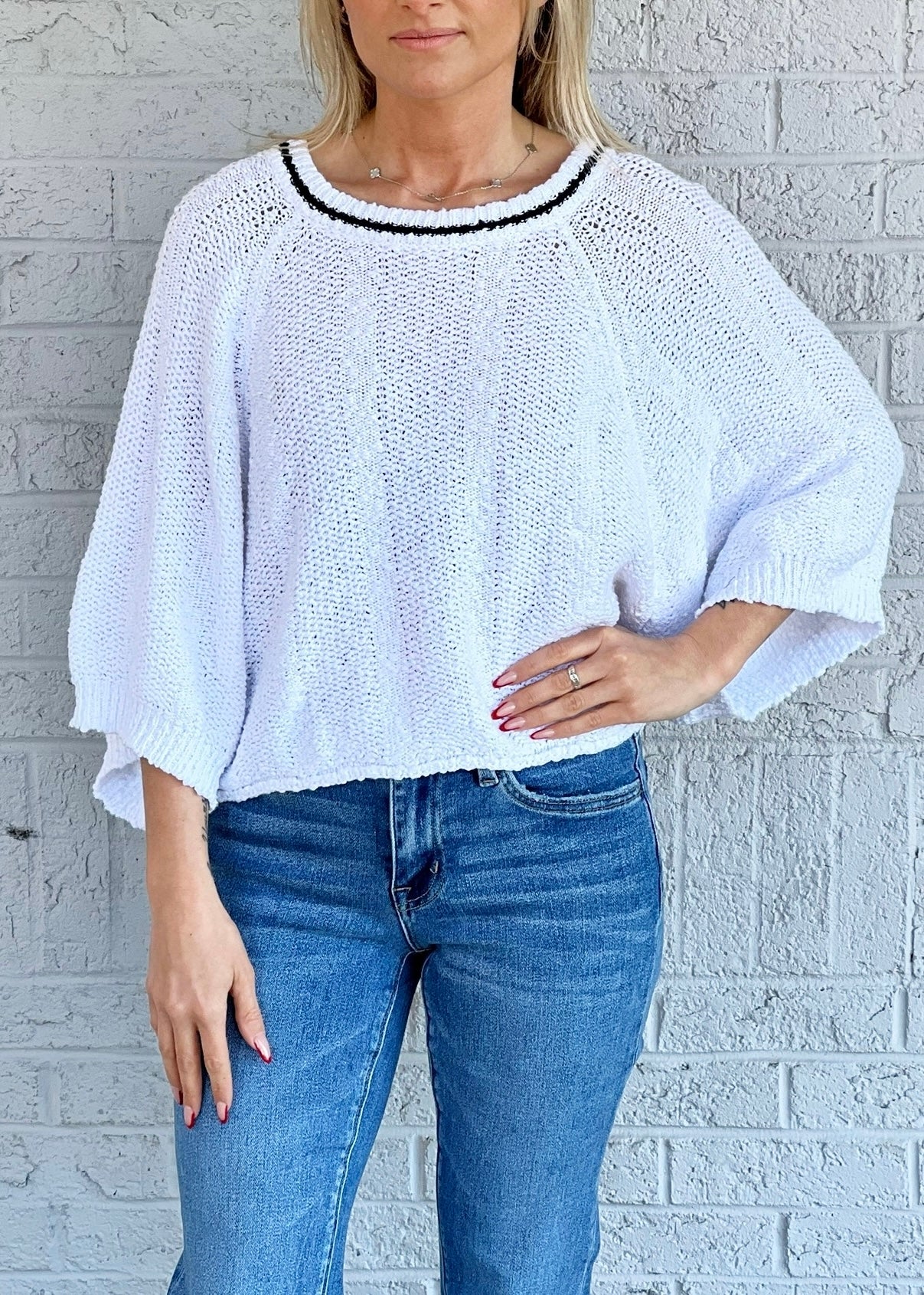 White with black trim sweater