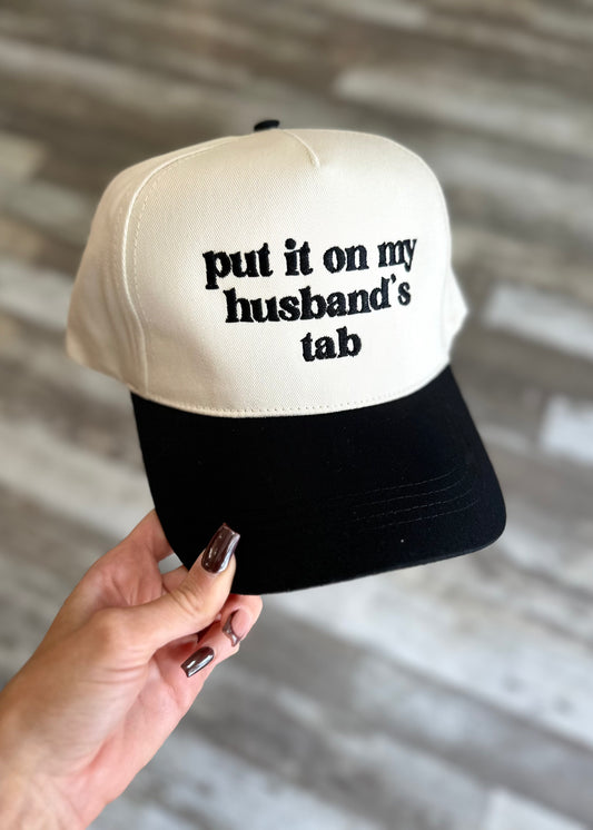 Put It On My Husbands Tab Trucker Hat